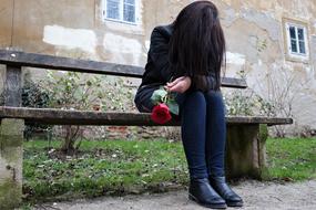 sad girl with a rose