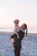 dog in woman hands