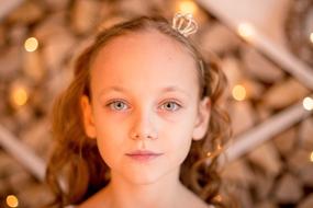 portrait of a little girl with white hair on a blurred background