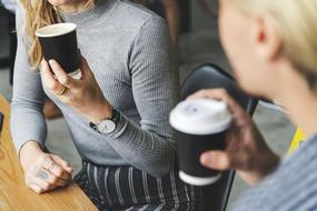 friends drinking coffee in paper cups