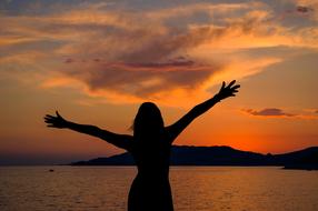 silhouette of a happy woman outdoor
