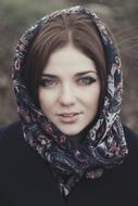 portrait of a beautiful girl in a scarf