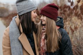 happy Mom and Daughter outdoor at fall