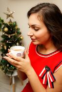 Christmas Mood, Girl with hot drink in cup at decoration