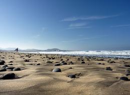 sand and round stones by the sea