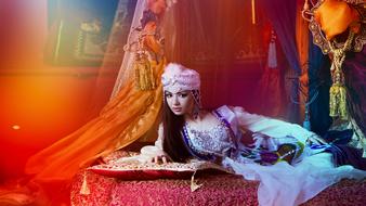 photo of a girl in an oriental dress on the bed