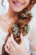 smiling Girl with flowers in hair, bride