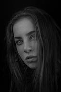 thoughtful young girl in darkness