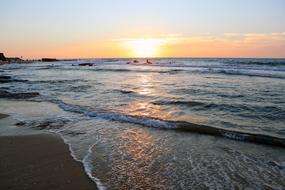 surf on Sea Beach at dusk, greece