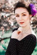 portrait of the beautiful girl model with violet head decoration