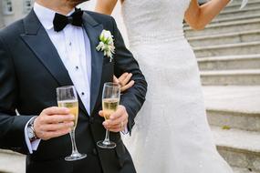 bride and groom with champagne in their hands