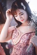 glamorous asian girl with a bouquet of flowers
