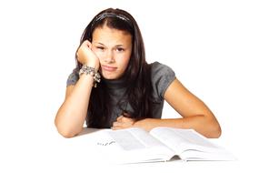 portrait of Book and bored young girl