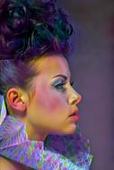 Portrait of Beautiful Fashion model with colorful makeup
