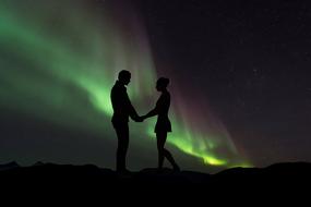 romantic couple and Northern Lights