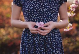 Female holding Flowers