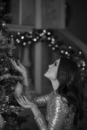 monochrome portrait of Girl near Christmas Tree