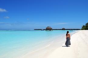 girl walking on the beach in the Maldives