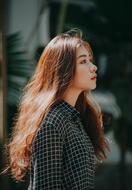 Portrait of attractive long hair Girl outdoor, side view