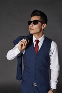 Businessman, young man wearing tie suit and sunglasses
