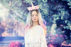 girl with flowers in bright rays of light