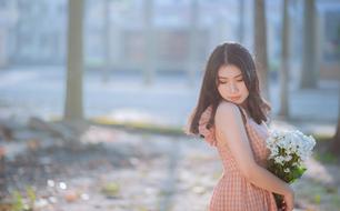 nice Girl with bunch of daisies outdoor