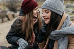 Family love, Mom and teen Daughter in winter clothe outdoor