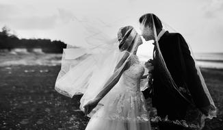 wedding couple kissing beneath veil outdoor, Black And White