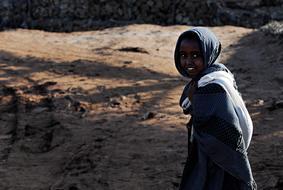 walking Ethiopian girl in the shadow