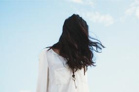 long hair Woman with Key on Necklace