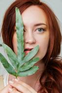Girl with green leaf