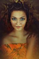 Portrait of the girl, with the colorful make-up, in orange and gold dress, in the autumn