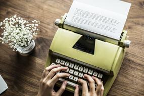 hands on vintage typewriter