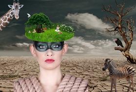 Woman with black mask and colorful field, on the head, among the animals and plants in the desert