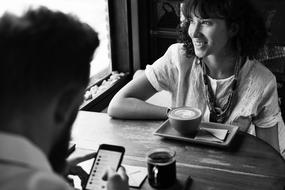 friends having coffee in cafe