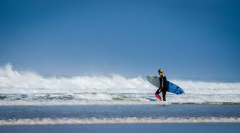 young woman with surfboard