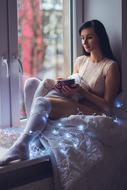 Woman relaxing in bed