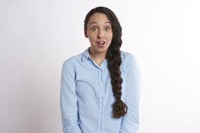 photo of a surprised woman student with a pigtail