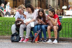 distracted girls with cellphones