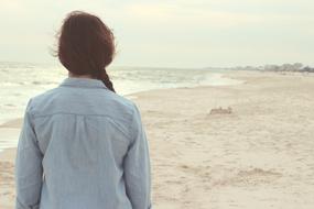 Woman in blue shirt on Beach