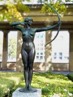 girl with a bow and arrow statue