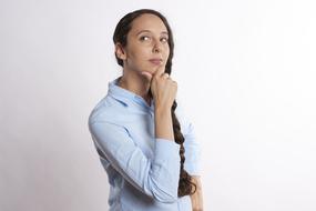 photo of a pensive woman with a long pigtail