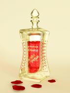 vintage bottle of red perfume