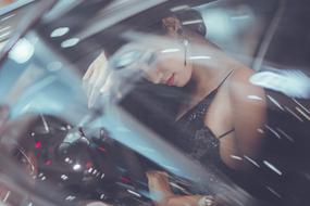 portrait of posing woman in the car
