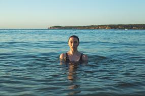 model posing in ocean water
