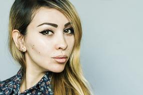 asian Woman with stylish makeup looking aside