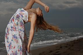 Beautiful Young Fashion Model on beach