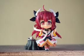cute girl with horns, plastic toy