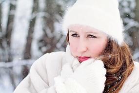 woman in winter clothe shivering with cold outdoor