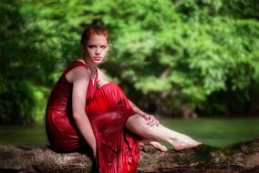 Girl Sitting Tree red dress